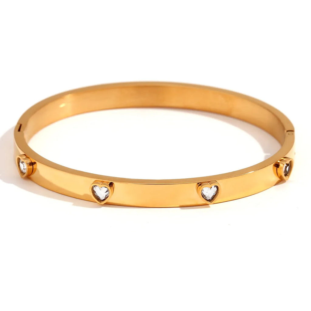 Stainless steel women's bracelet with micro-inlaid peach heart design in golden electroplated finish