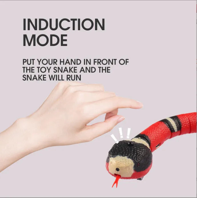 Interactive electric induction snake cat toy with S-shaped body, flashing eyes, and retractable tongue on a floor