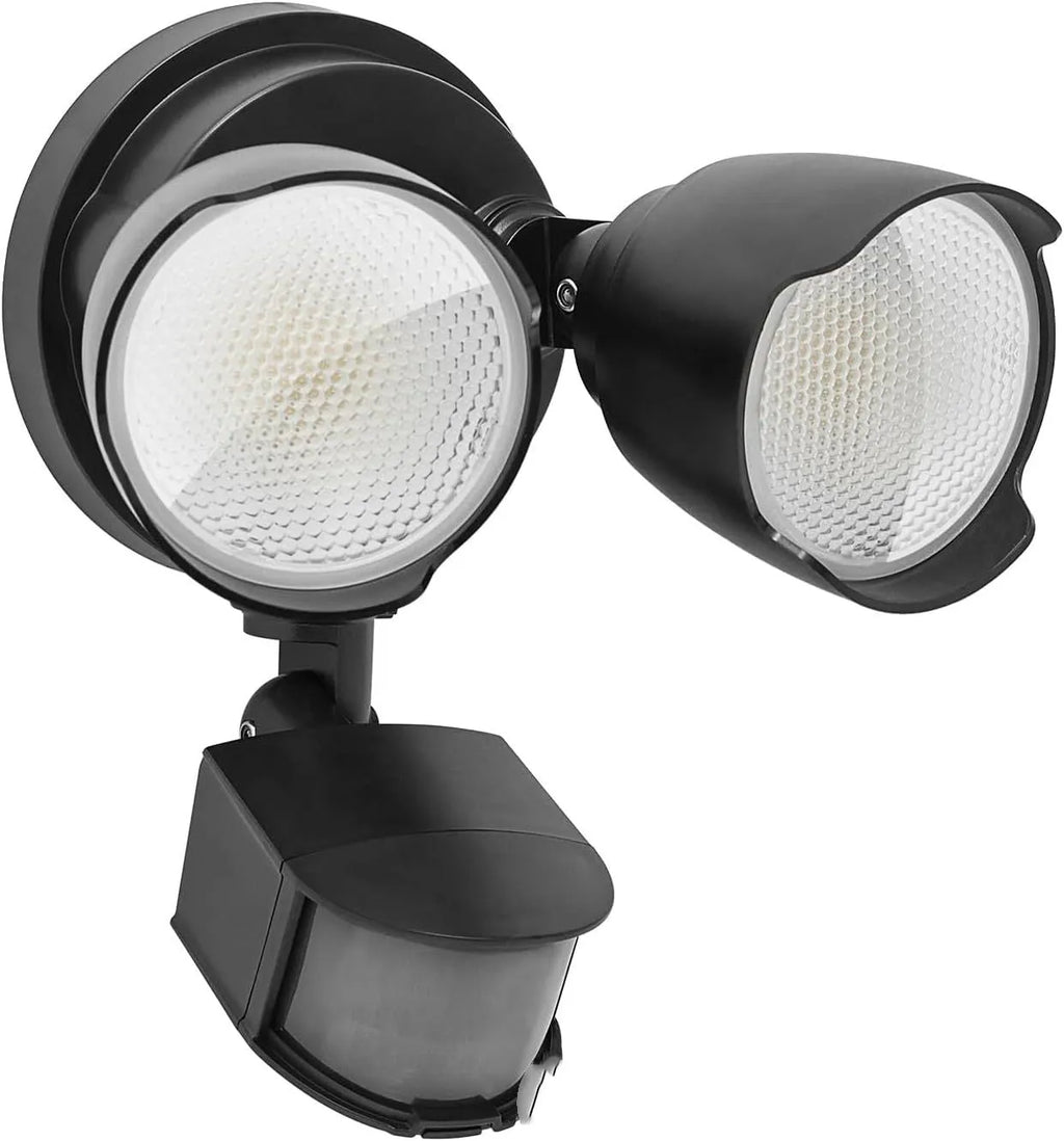 White outdoor LED flood light with motion sensor mounted on wall
