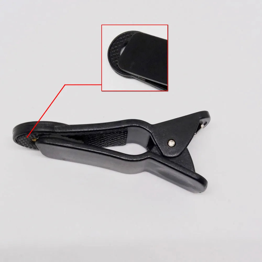 12x telescopic zoom lens with universal collar clip attached to a mobile phone for long-distance filming.