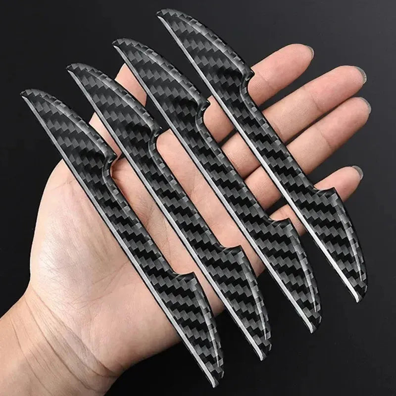Black carbon fibre texture car door edge protector strips laid out flat.