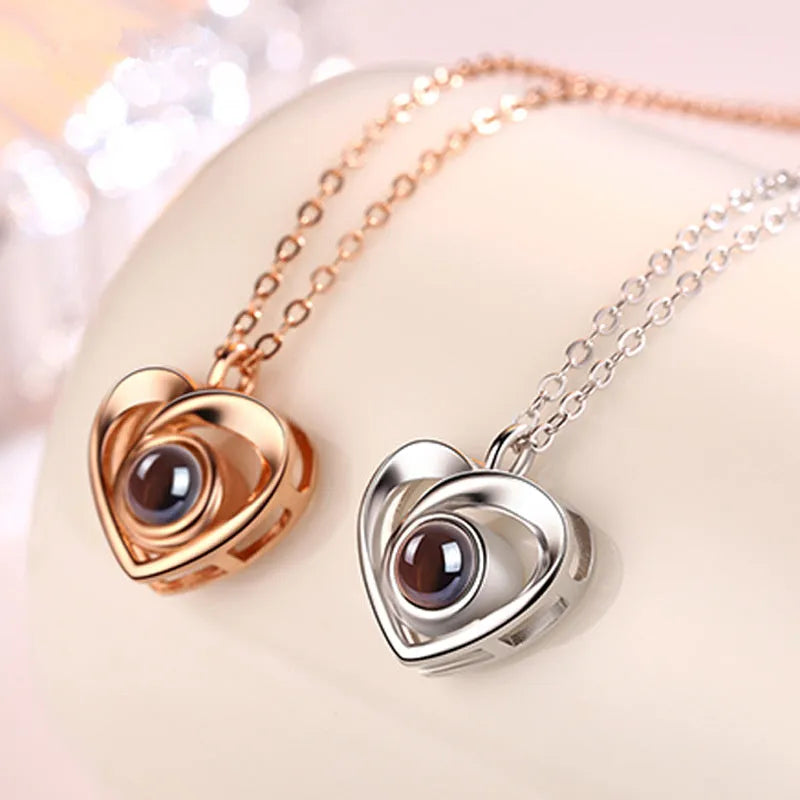 S925 silver heart shaped photo projection pendant necklace with silver finish on white background