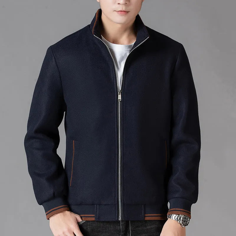 Men's grey polyester fleece jacket with long sleeves and side pockets shown in sports style