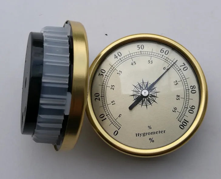 Analogue thermometer and hygrometer with aluminium dial showing humidity and temperature readings