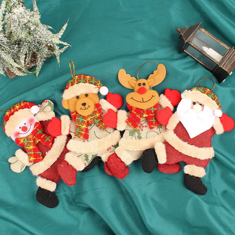 Christmas tree ornaments set with Santa, snowman, reindeer and bear figures in red and white scarves, golden balls and red bows.