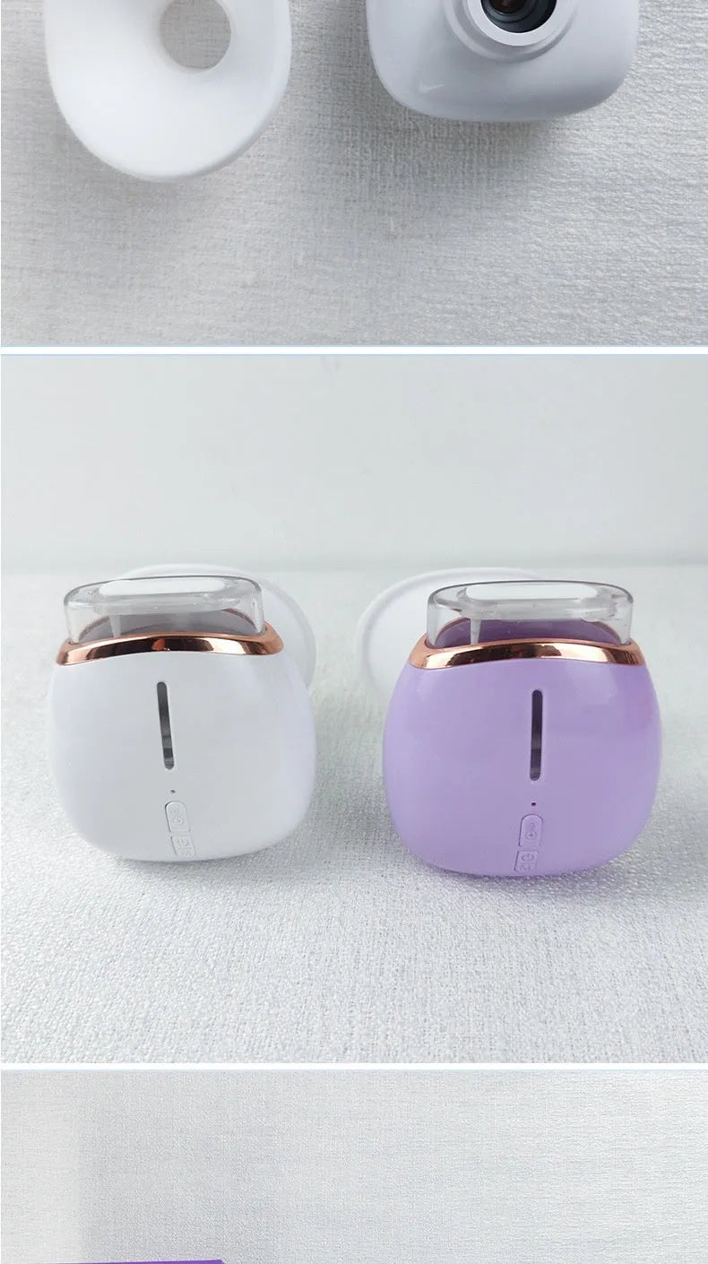 White and purple portable eye humidifier with USB charging cable on white background