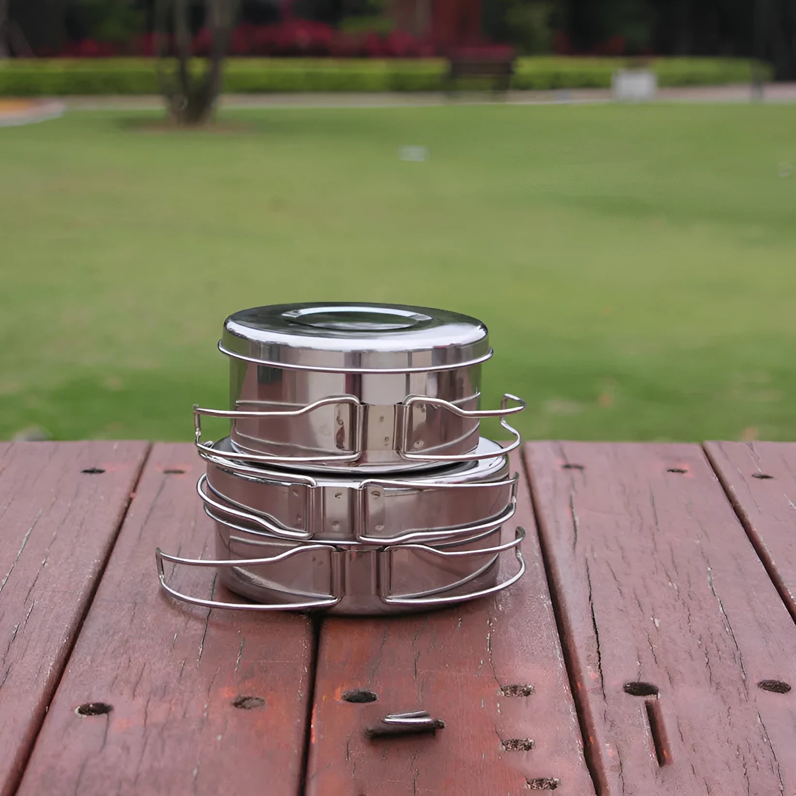 Silver stainless steel round camping cookware set with four pieces for outdoor use