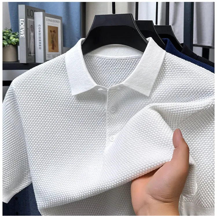 Man wearing a loose fit grey cotton short sleeve sweater, casual pullover style
