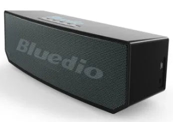 Black rectangular smart speaker with AI voice assistant, showing front grille and micro-USB port.