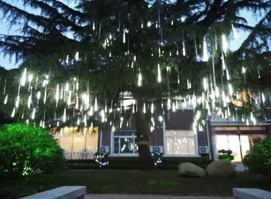Blue and white LED meteor shower lights in 50cm length with waterproof PC tubes outdoors at night.