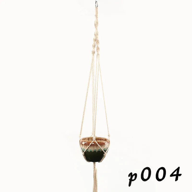 A rustic woven wire plant basket made from cotton rope, holding a green potted plant.