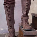 Women's long boots with lace-up front, low heel, artificial PU upper, rubber sole, in black colour