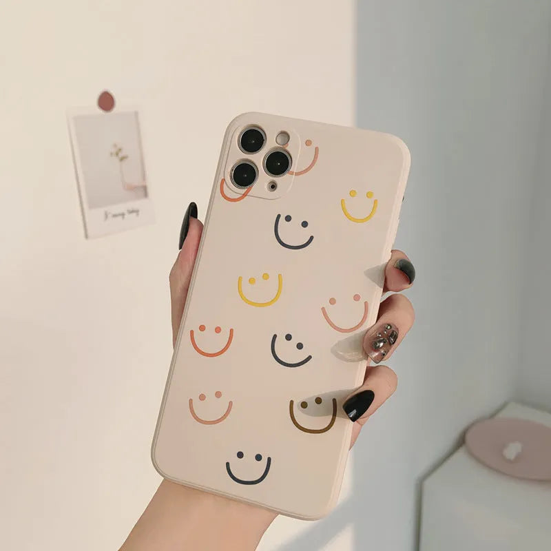 Simple silicone iPhone case with painted graffiti and stripe designs on a TPU back cover.