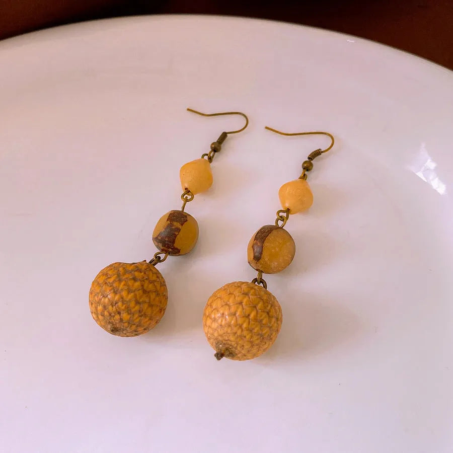 Resin fruit core tassel earrings in brown geometric round shape ethnic style for women