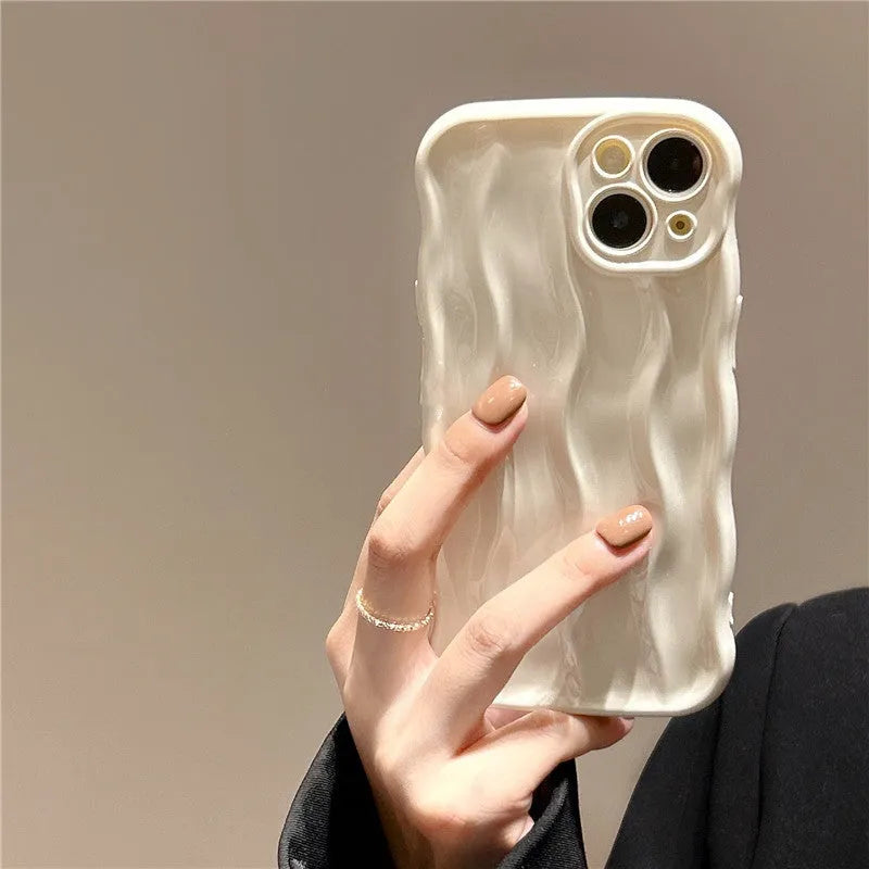 Silicone iPhone case with water ripple texture in green, shown on an iPhone 17 Pro Max.