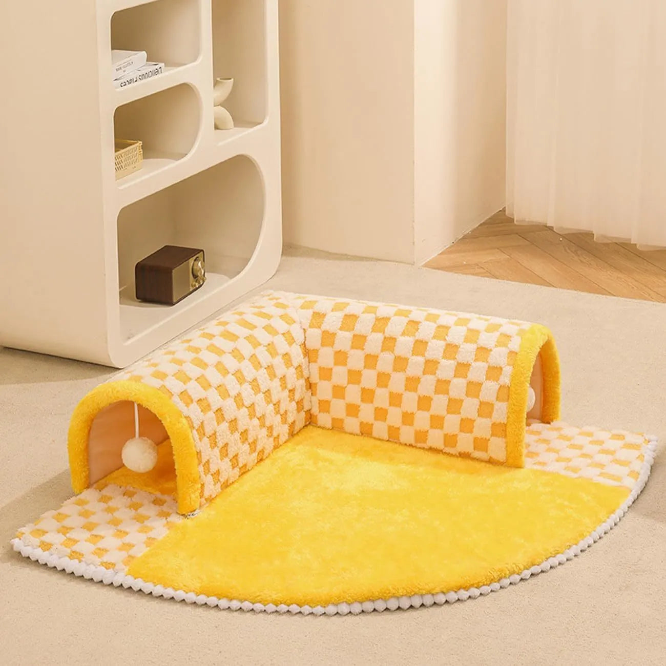 Coffee coloured plush dog and cat bed with integrated tunnel, shown in a fan-shaped plaid design