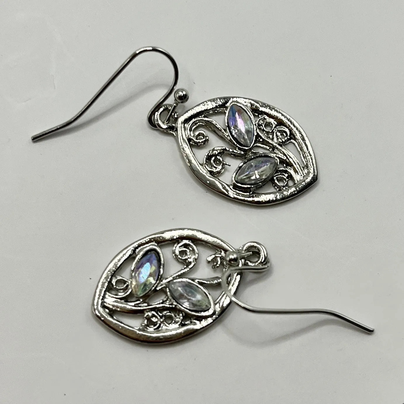 Women's silver leaf-shaped drop earrings with embedded colourful moonstone gemstones