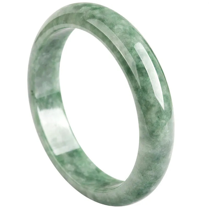 Natural emerald bean green simple solid bracelet on a gift box, showing dark pea green colour.