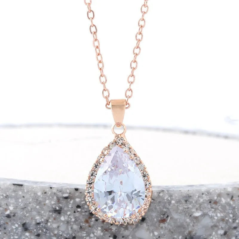 Rose gold water drop necklace with geometric rhinestones in pink colour
