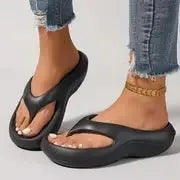 Women's thick-soled EVA flip-flops in black, white or grey with non-slip patterned soles