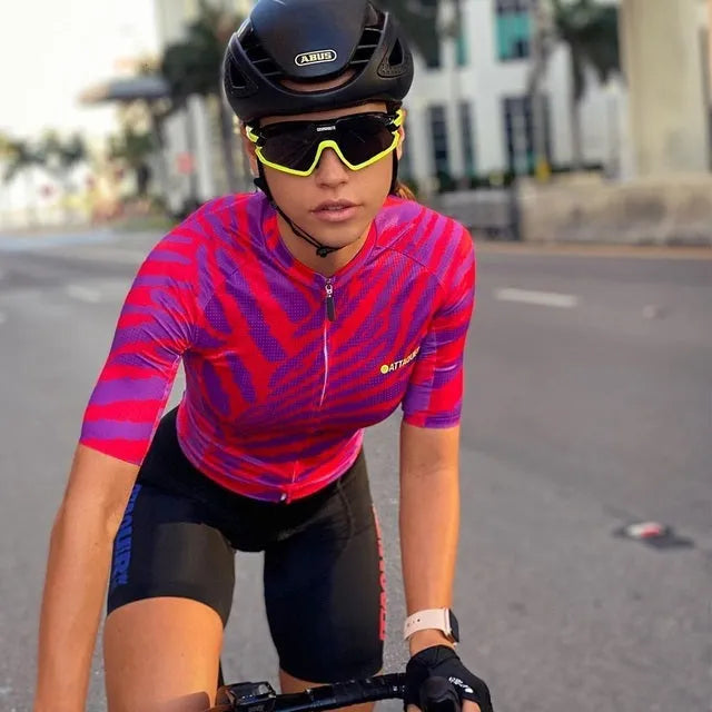 Attaquer women's long sleeve kaleidoscope print cycling jersey and pants set on a hanger