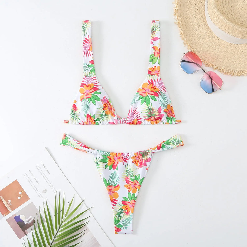 Women's floral print bikini swimsuit in blue colour with matching bra and briefs
