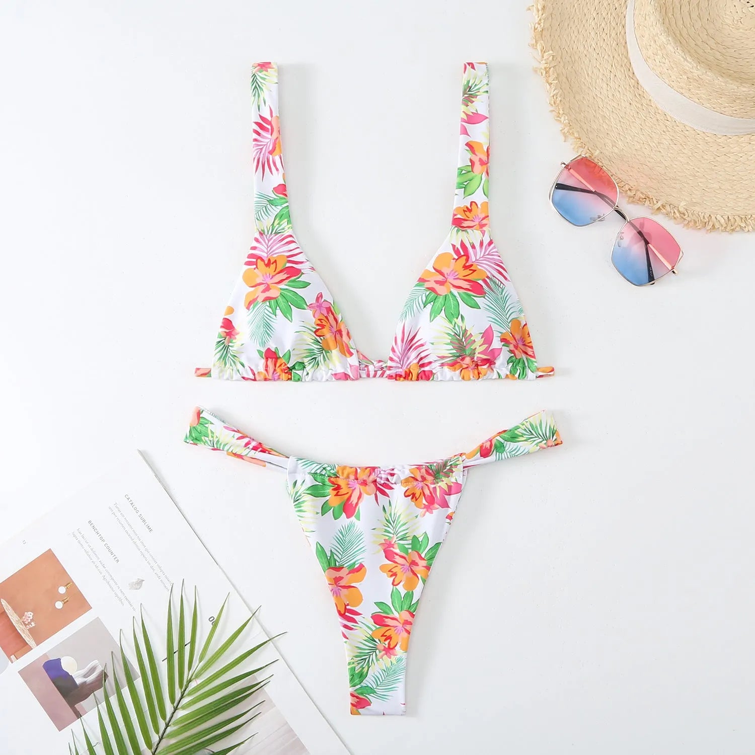 Women's floral print bikini swimsuit in blue colour with matching bra and briefs