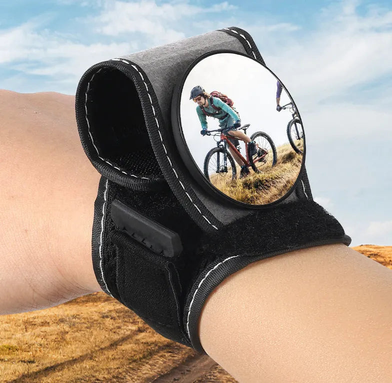 Black wrist-mounted bicycle rear-view mirror with adjustable nylon strap for cycling safety