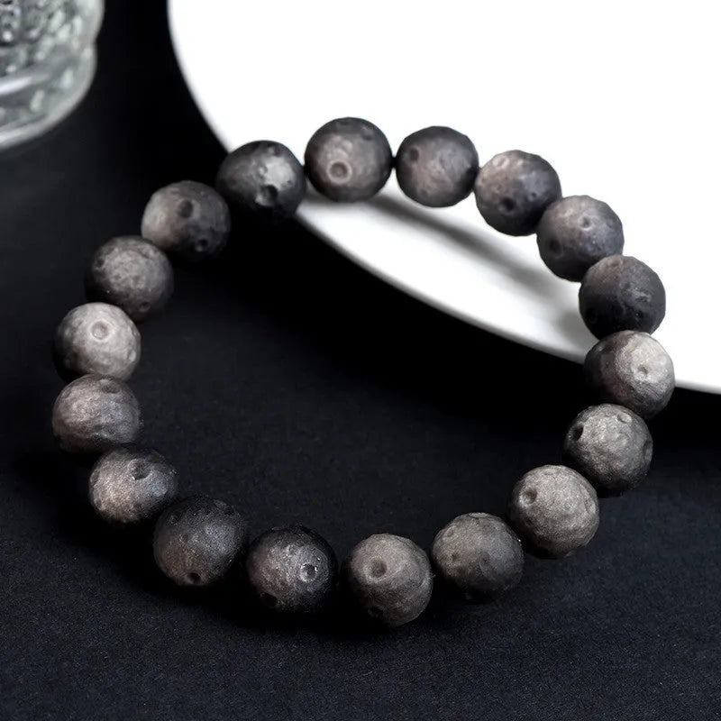 Natural obsidian crater ball bracelet with grinding texture in silver or golden meteorite colours