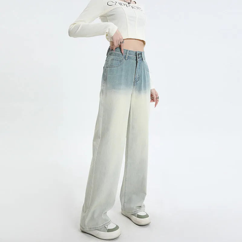 Women's gradient blue straight-leg denim trousers showing colour gradation effect and contemporary cut