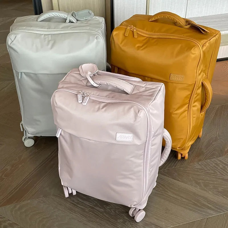 Waterproof Oxford cloth suitcase with universal wheels in bluestone green colour showing three size options