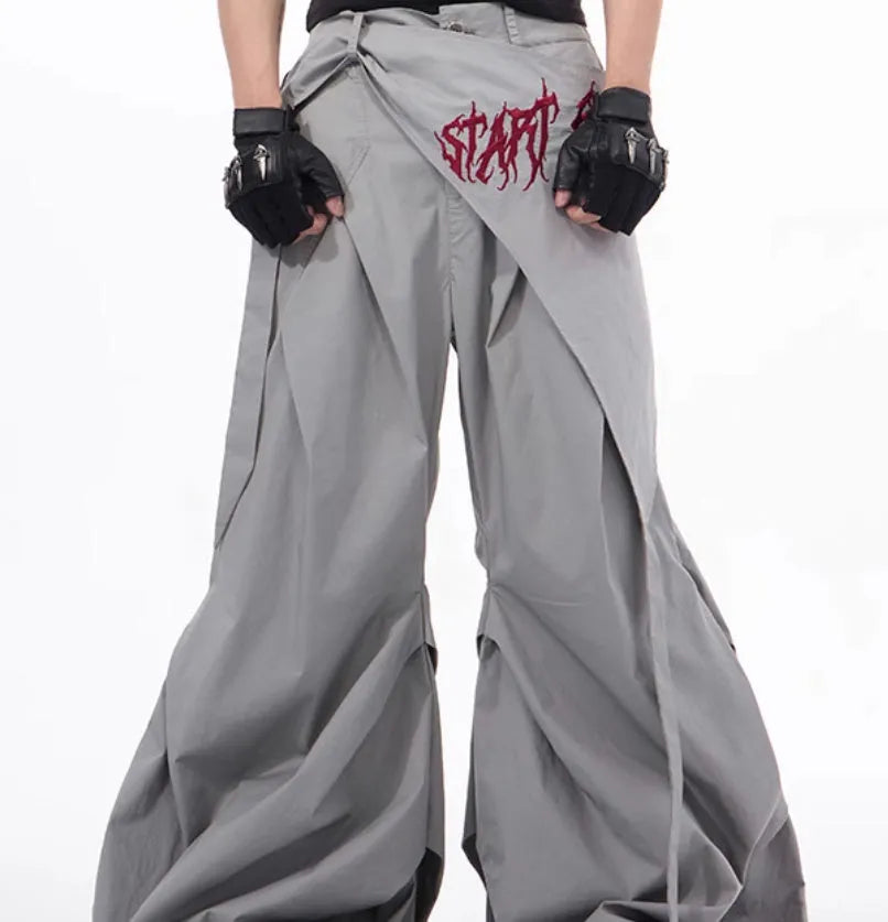 Boy modelling black wide-leg summer trousers with a relaxed fit and Korean-inspired style.