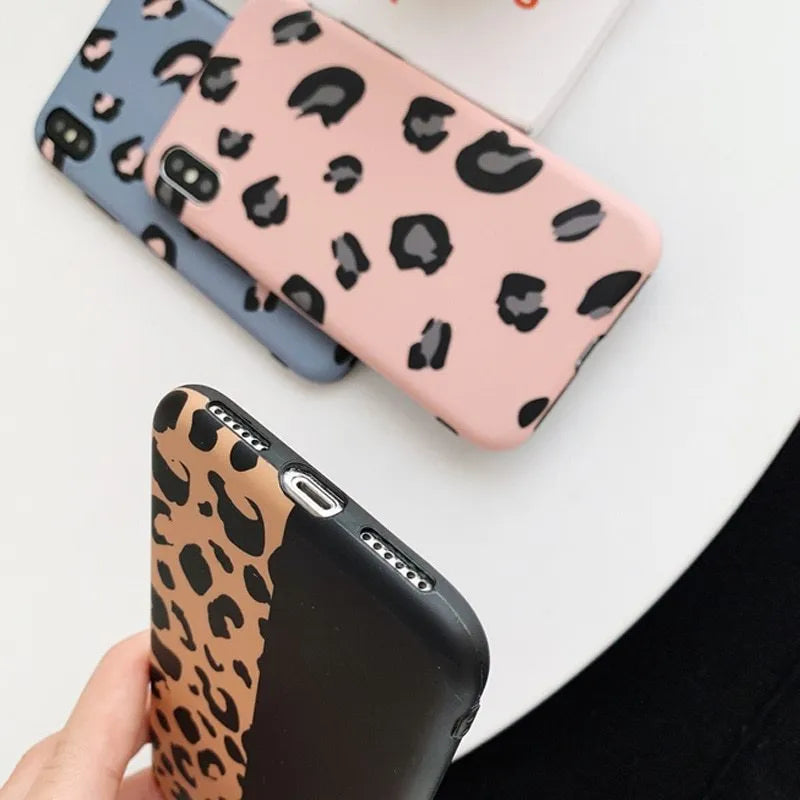 Leopard print pattern hard case for iPhone in black, blue, or pink.