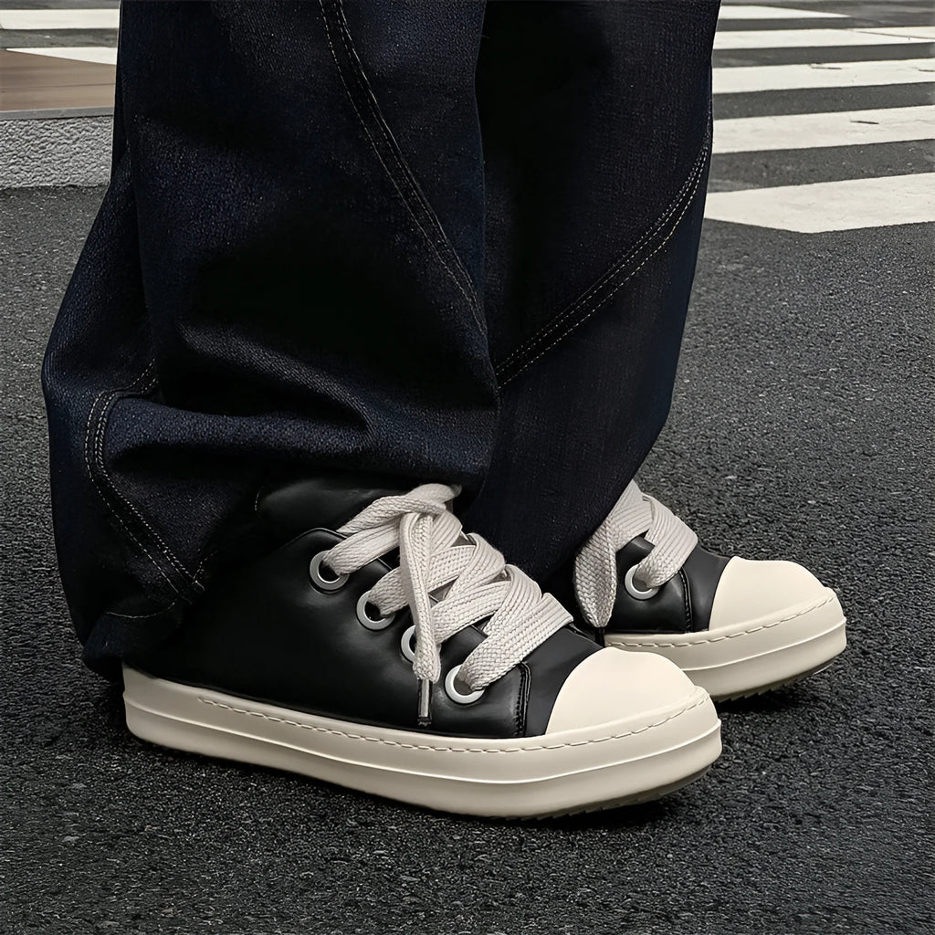 Men's black casual slip-on shoes with front lace-up and rubber sole