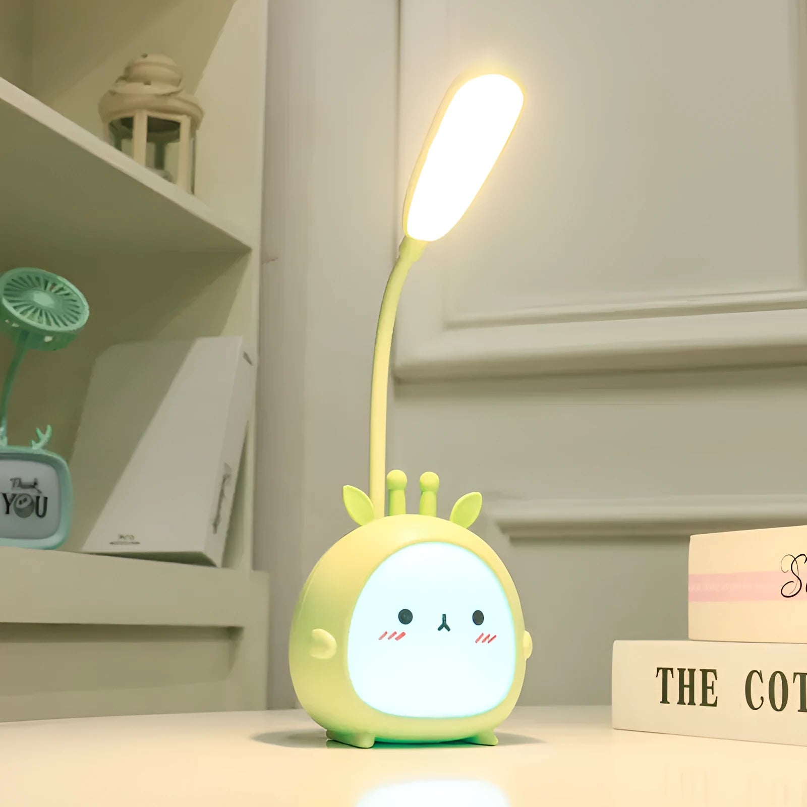 Cartoon deer USB charging folding LED reading lamp with plastic shade on desk