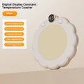 White plug-in thermal coaster on desk with push-button controls and power cord