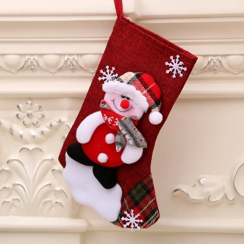 Multicolor Christmas gift bag with hanging socks in old man, snowman, deer and bear designs for festive gift-giving