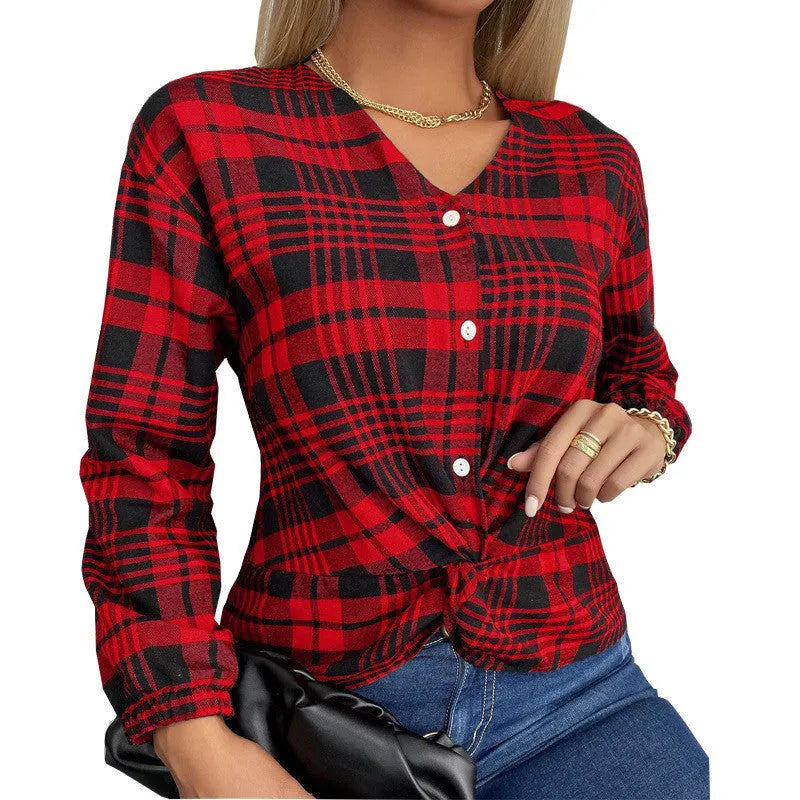 Women's purple, grey, and red plaid loose fit shirt with regular sleeves on a hanger.
