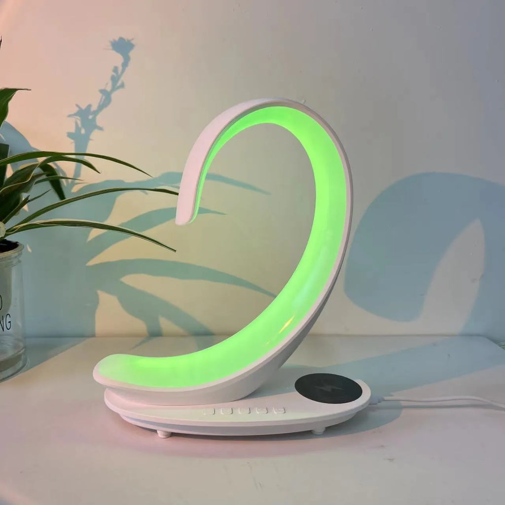 White swan shaped desktop wireless charger with Bluetooth speaker and colourful atmospheric lighting