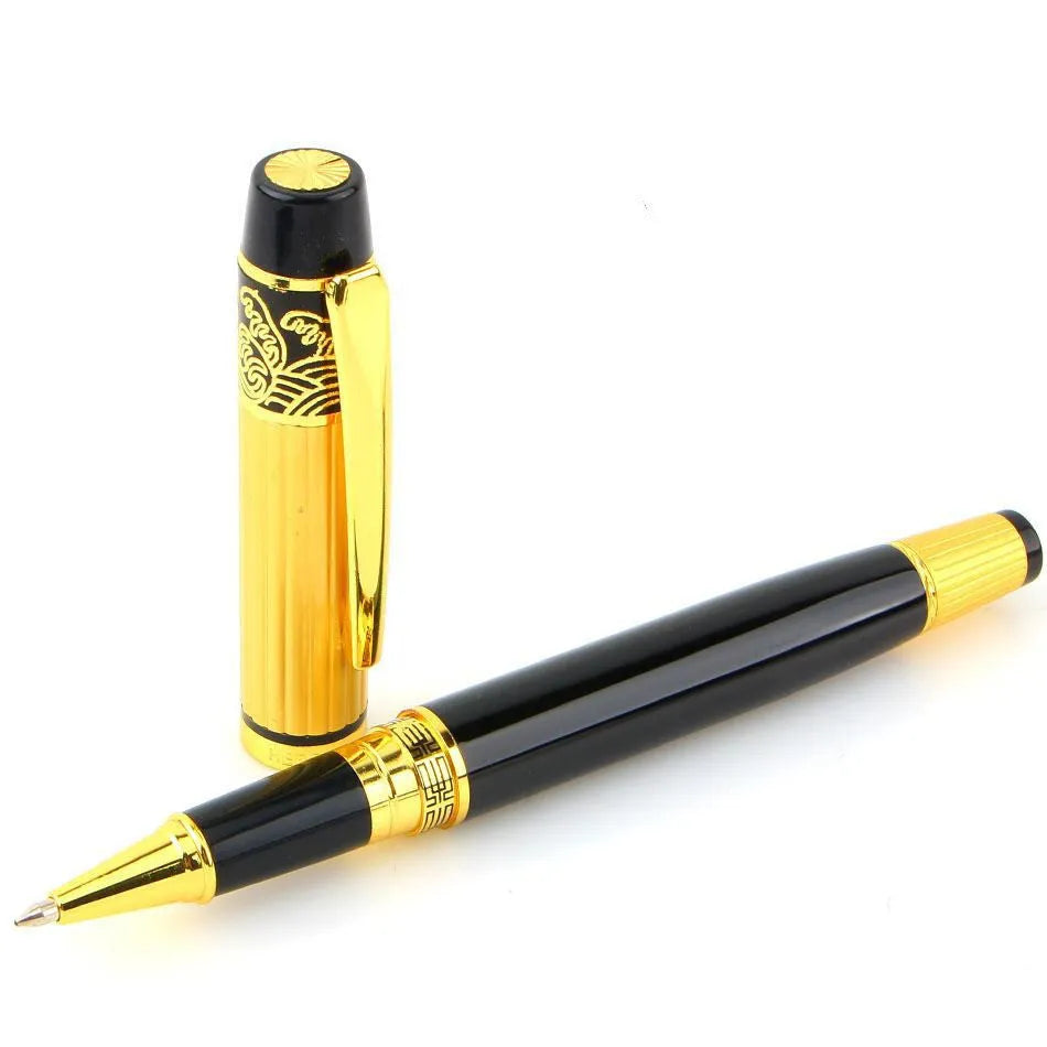 Black metal fountain pen with iridium nib and patterned orb design, shown on a desk