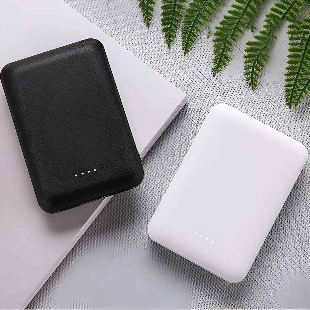 Ultra-thin 10,000mAh power bank with multi-USB ports in black or white
