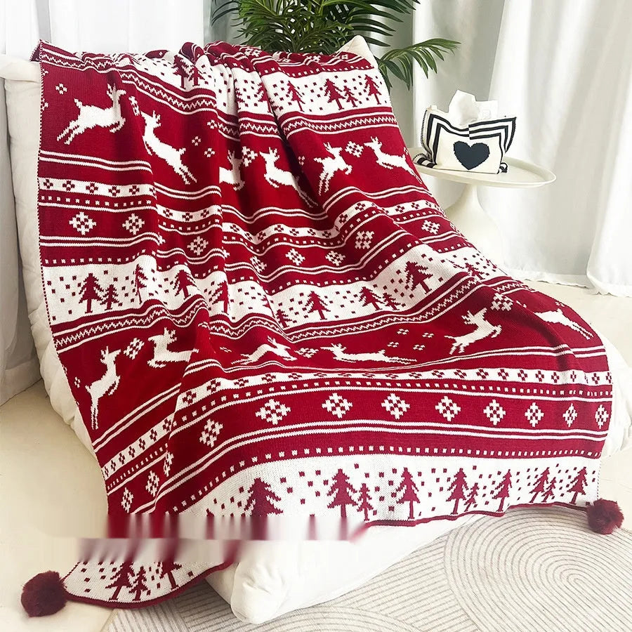 Personalised Christmas acrylic blanket with snowflake design draped over a sofa