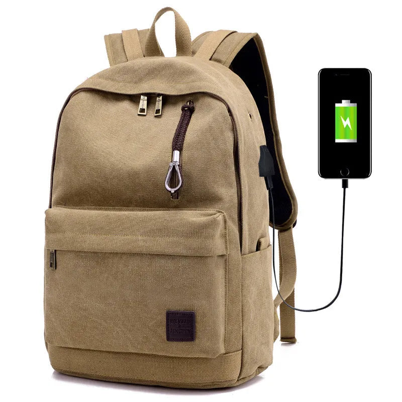 Canvas backpack with USB charging port showing computer compartment and multiple pockets