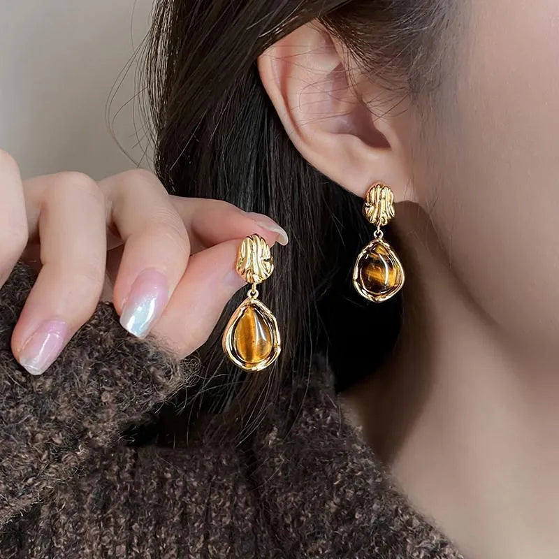 Three pairs of geometric tassel ear rings with electroplated alloy construction in different designs