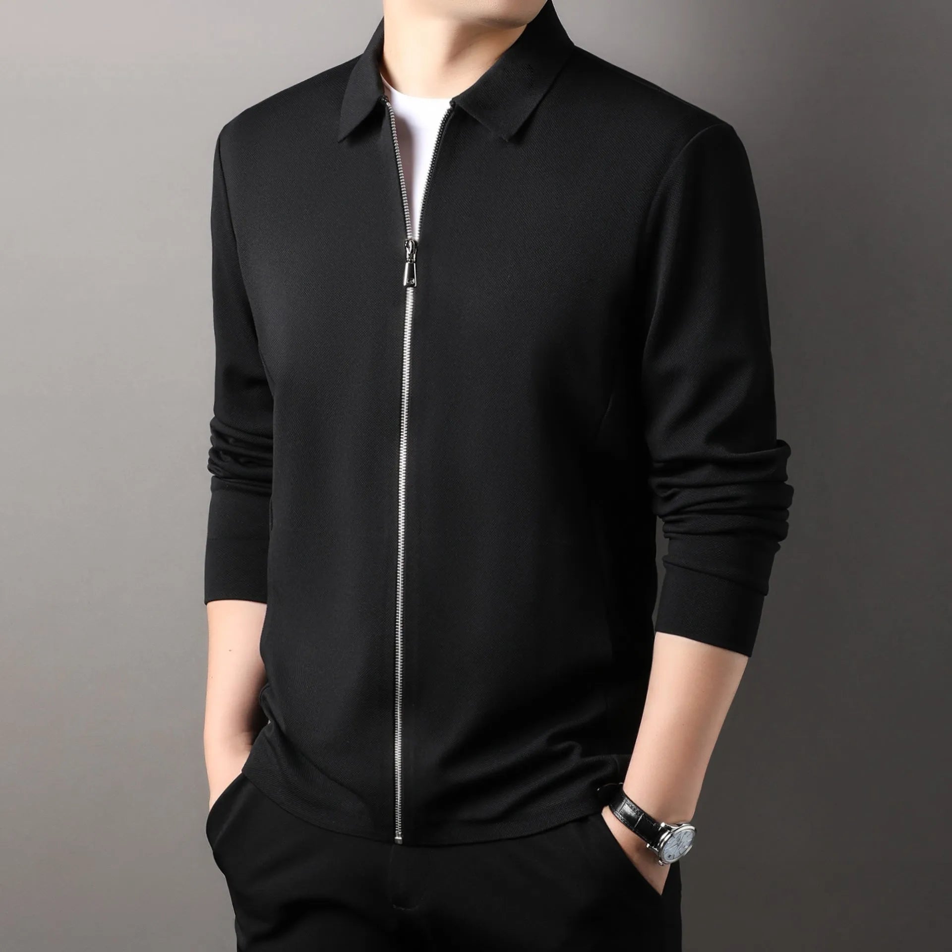 Men's black polyester casual business jacket with long sleeves on a hanger.