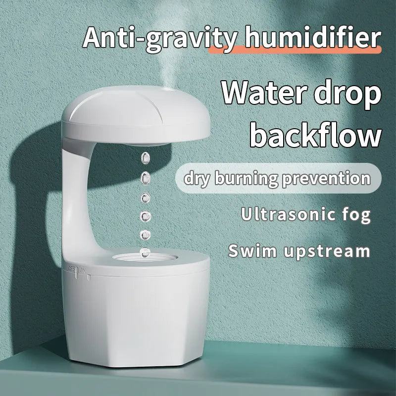 White portable 800ml anti gravity USB cool mist aromatherapy humidifier on a bedside table with water droplet effect visible