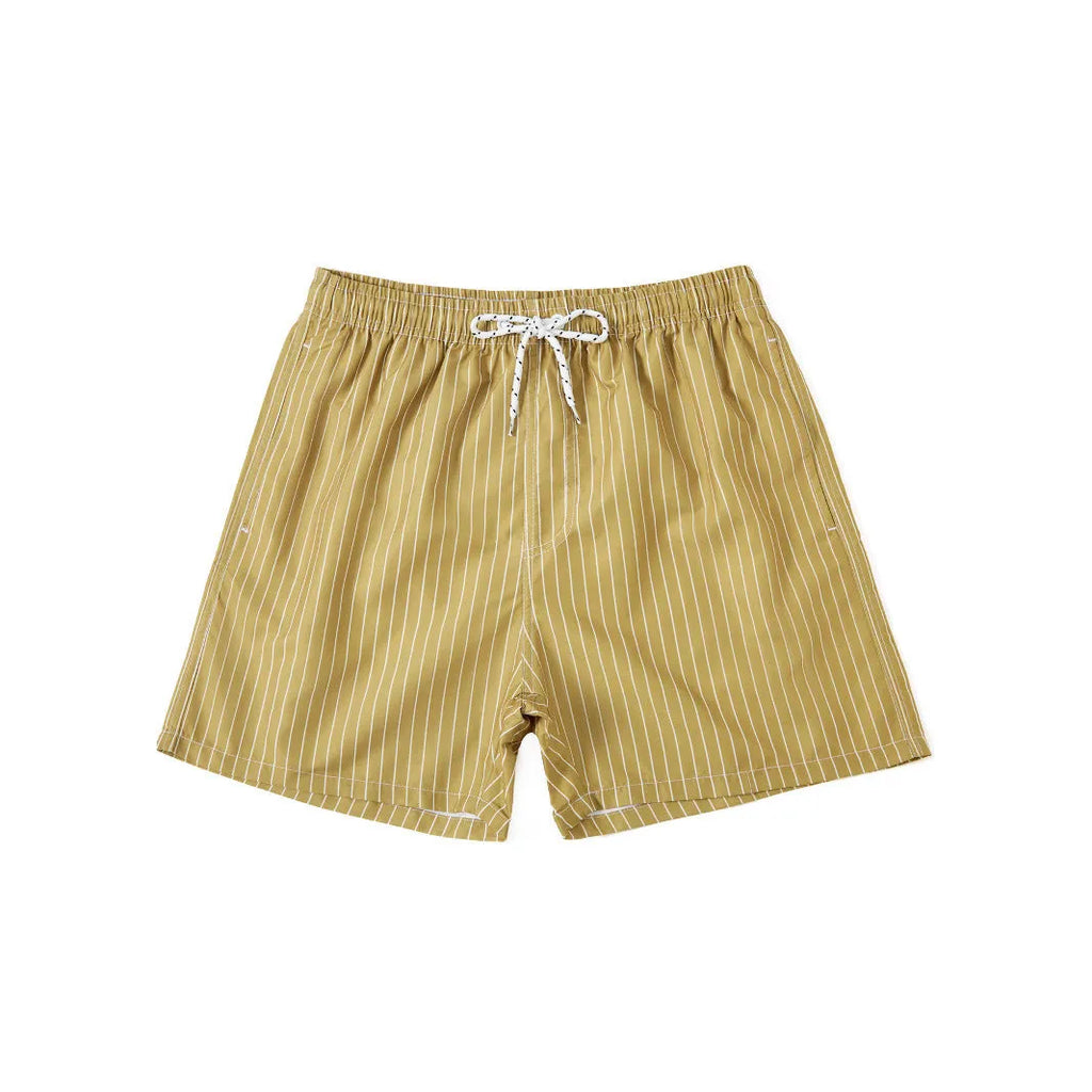 A pair of striped beach shorts in a light blue colour with a straight leg opening, laid flat.