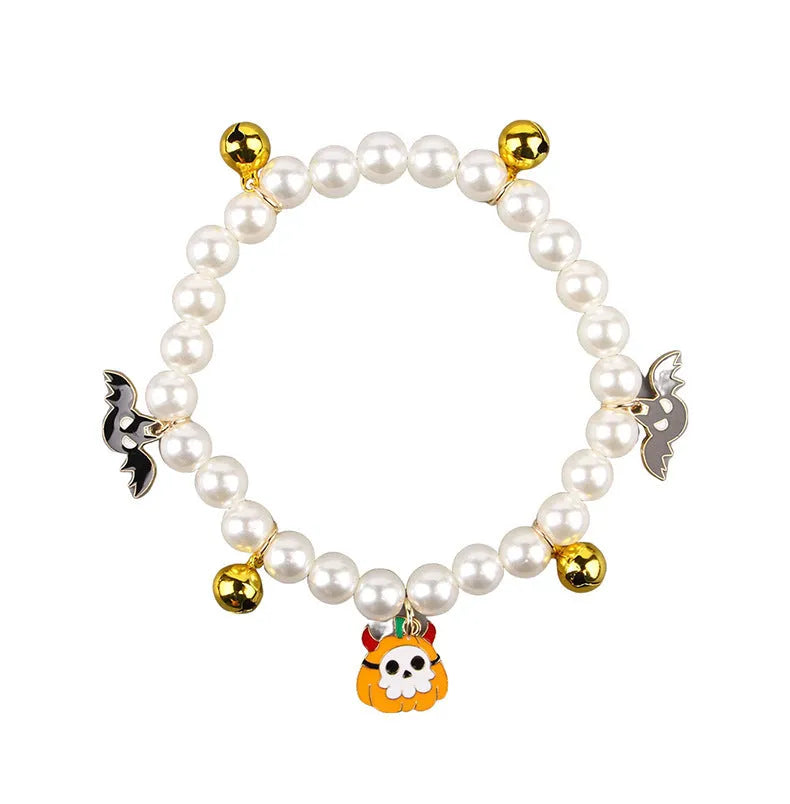 Simulated pearl necklace pet collar decoration with a pumpkin charm for Halloween.