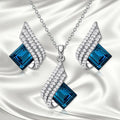 Glass pendant on alloy cross chain necklace with matching electroplated earring studs set