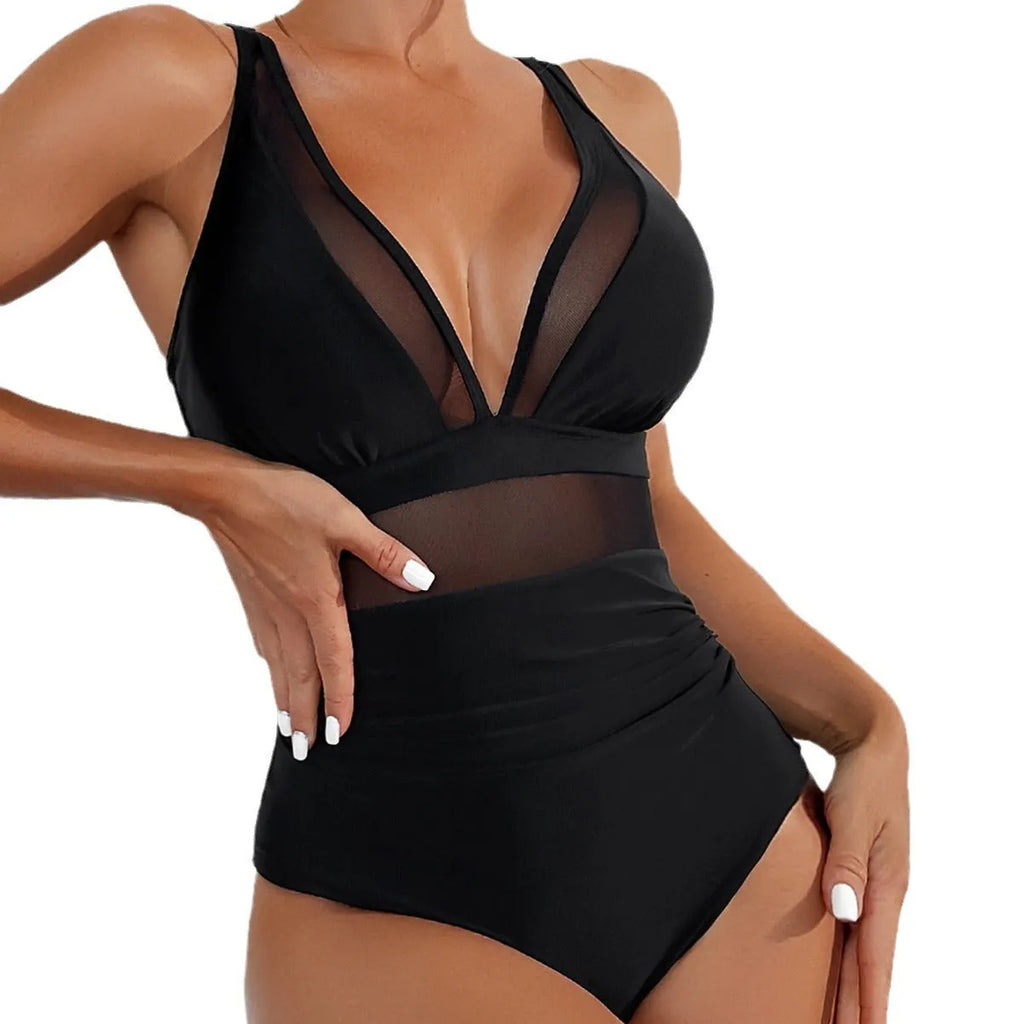 Black women's halter neck one-piece swimsuit with cross-back straps and briefs bottom.